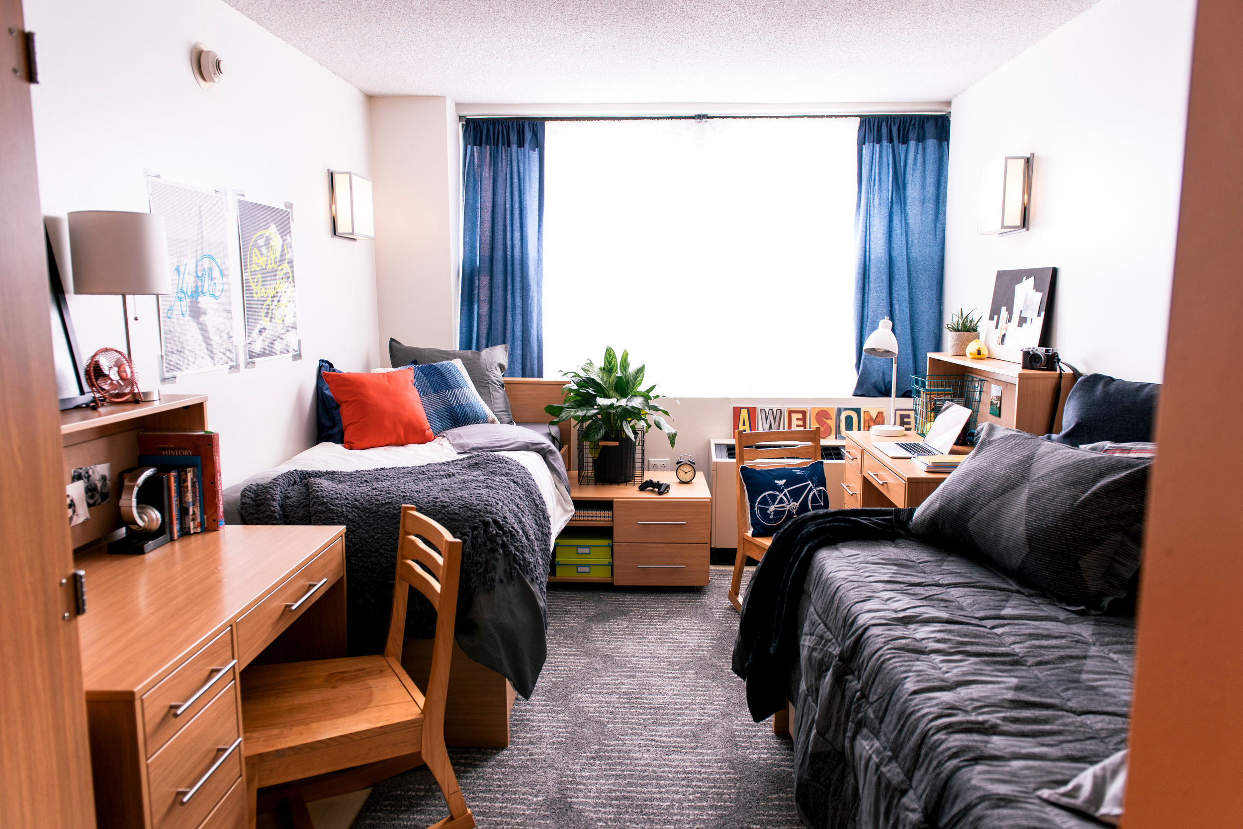 Dorm room essentials including electronics, clothing, and textbooks